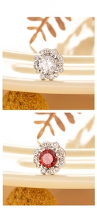 Detail of round heart-and-arrow zircon earrings in red and white stone options