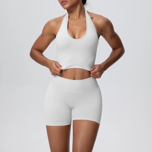 Detailed texture of seamless white halter yoga top and high waist compression shorts