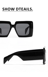 Detail view of large square black sunglasses showing the wide temple and dark grey lens