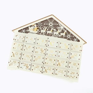 Detail of wooden house-shaped 24-day advent calendar with laser-cut reindeer and drawers