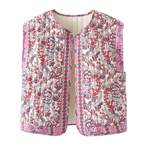 Ethnic floral quilted vest in pink and blue tones, professional flat lay on white background