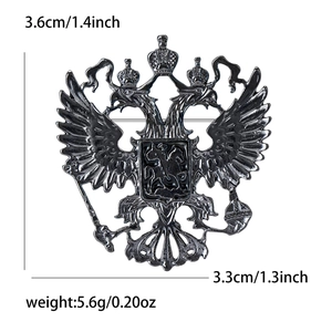 Detailed view of black metal double-headed eagle brooch with dimensions and weight