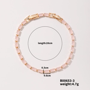 Detail view of pink crystal bracelet with gold setting and size specifications