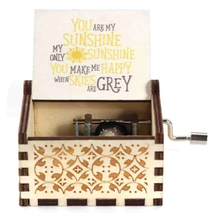 Handcranked wooden music box with You Are My Sunshine engraving and vintage floral carvings