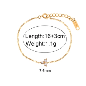 Gold 18K plated stainless steel bracelet featuring three white zircon lotus charms