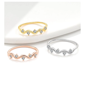 Detailed view of s925 silver wave rings in gold, rose gold and silver with zircon