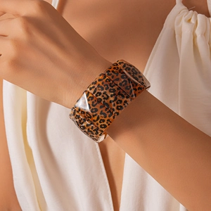 Close-up of modular acrylic leopard print chunky bracelet with high glossy finish