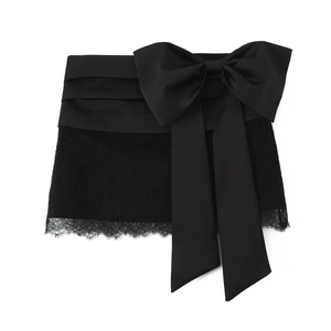 Elegant black satin mini skirt with delicate lace trim and large decorative bow detail