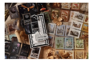Macro detail of vintage PET stamp stickers and bookmarks with flowers on burlap texture