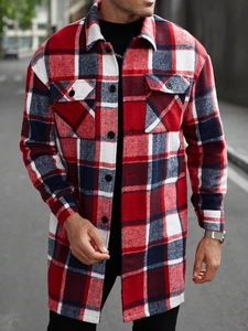 Detail view of men's red plaid flannel shirt with dual chest pockets and button closure