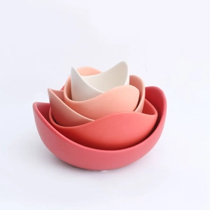Top view of creative lotus-shaped ceramic bowls with elegant red-to-white gradient design