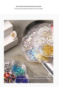 Detailed seven-compartment organizer box with mixed nail art pearls and colorful rhinestones