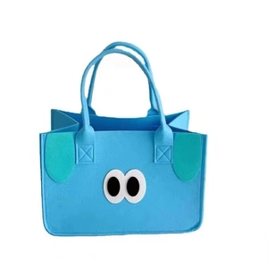Cute blue felt tote bag with cartoon eyes and green ears for gift shopping storage
