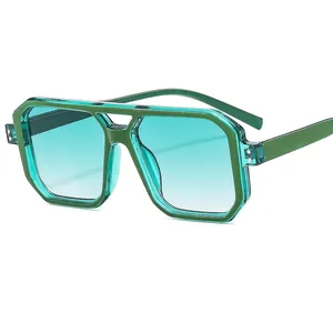 Modern double bridge geometric sunglasses in transparent green with gradient lenses