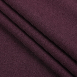 Close-up of deep purple fabric with fine diagonal twill texture and soft elegant drape