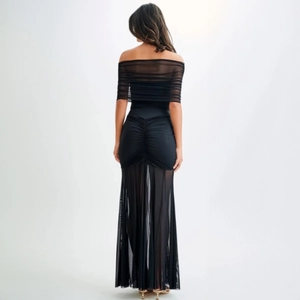 Elegant black off-shoulder maxi dress with ruched back detail and mesh patchwork