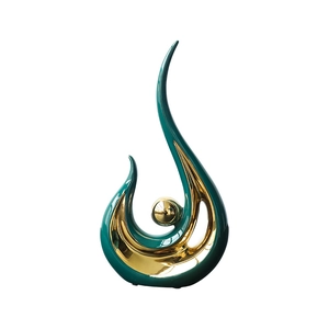 Modern abstract ceramic phoenix sculpture in emerald green and gold for home decor
