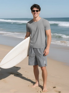Outdoor shot of men's breathable grey short sleeve t-shirt and athletic shorts set