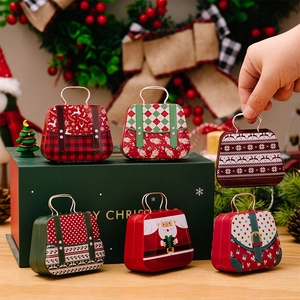 Set of six Christmas tinplate mini handbags with festive reindeer and Santa patterns