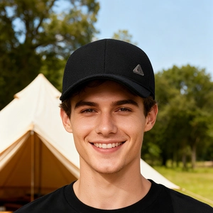 Winter thermal baseball cap with ear protection and metal logo worn outdoors by male model