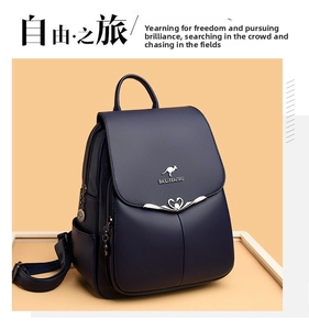 Detail of navy blue pebble leather backpack featuring kangaroo logo and heart lock buckle