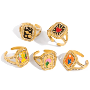 Set of five gold adjustable heart and celestial rings with colorful enamel and crystals