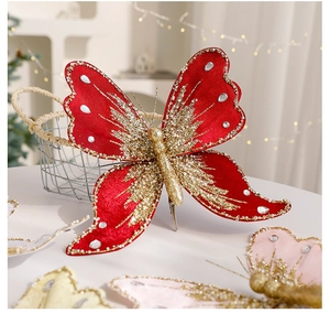 Detail of red fabric Christmas butterfly clip with gold glitter and faux diamonds