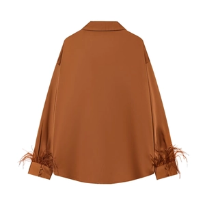 Elegant caramel satin long-sleeve blouse with stylish feather trim on the back view