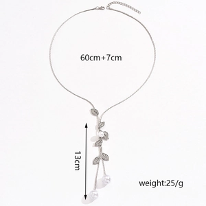 Detailed view of silver leaf necklace showing 60cm chain length and pearl accents