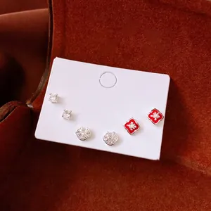 Elegant silver zircon earring set featuring clover motifs and sparkling round stones