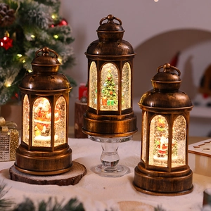 Three vintage bronze Christmas lanterns with glitter liquid and LED Santa figurines