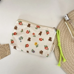 Korean style canvas pouch with bear and floral pattern and neon green rope zipper