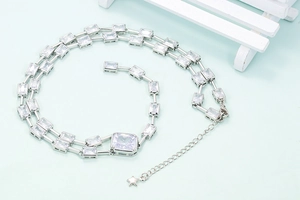 Exaggerated long chain necklace with square-cut zircons and a small star pendant charm