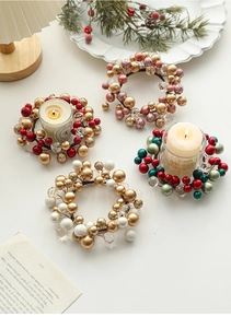 Macro shot of 13cm beaded candle rings in festive red, gold, and white colors