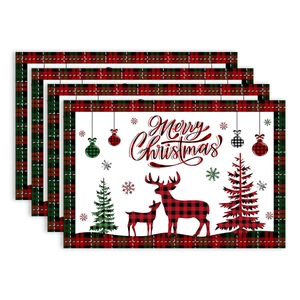 Set of four red and black plaid Christmas placemats featuring moose and tree patterns