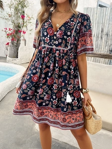 Detailed boho short sleeve dress with deep blue paisley print and tassel drawstrings