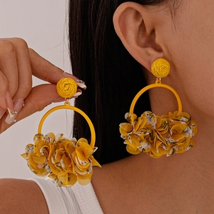 Bohemian yellow fabric floral drop earrings with woven studs and large geometric rings