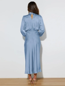 Detail of the backless cutout design on light blue satin halter dress with silk texture