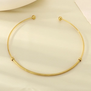 Golden stainless steel twisted wire choker necklace with minimalist bead detail