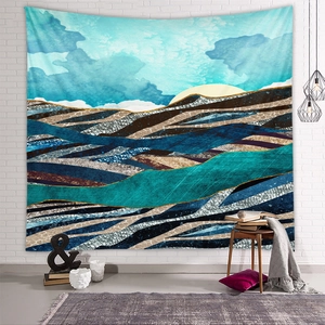 Close-up of abstract mountain wall tapestry with blue and gold texture in modern home decor