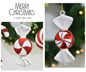 Detail of red and white glitter candy cane ornaments for festive Christmas tree decor