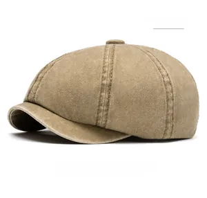 Detailed side view of khaki washed cotton newsboy cap showing stitching and fabric texture