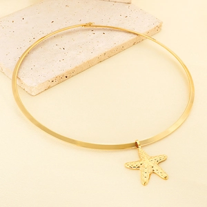 Chic gold stainless steel collar necklace featuring a textured starfish pendant on stone