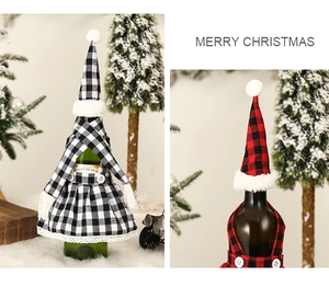 Detail of red and black buffalo plaid Christmas wine bottle covers with mini skirts and hats