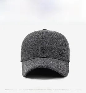 Close-up of dark grey tweed baseball cap with fine woven texture and metal detail