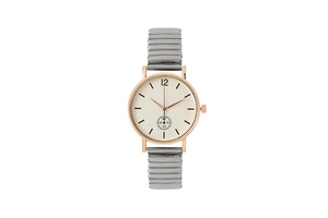 Détail d'une montre à quartz or rose avec bracelet extensible et petit cadran seconde