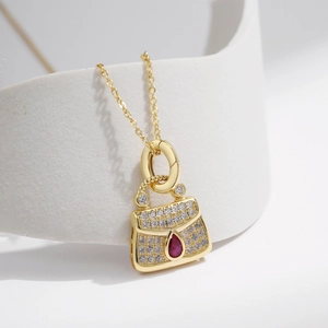 Luxurious S925 silver golden handbag necklace pendant with diamonds and red gemstone