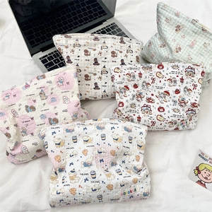 Detailed collection of quilted floral cosmetic bags with cute cartoon animal patterns