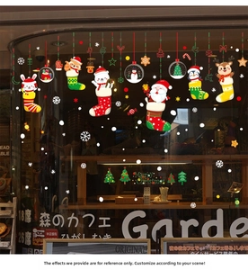 Detail of Christmas cartoon static window stickers on a glass surface for festive decoration