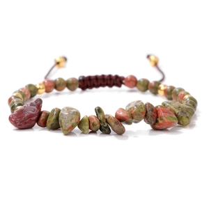 Detailed macro view of Unakite stone beads on an adjustable woven bracelet with gold spacers